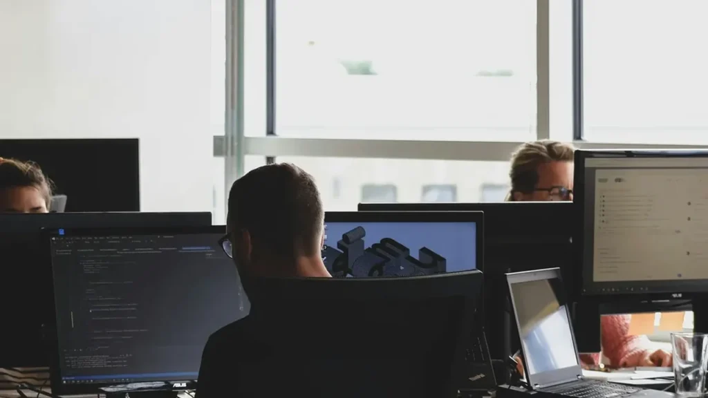 Engineers administering and monitoring computer systems